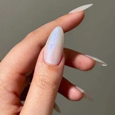Long nails with pearl polish.