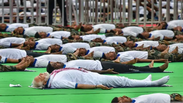 Shavasana | Shavasana, which translates to "corpse pose" in English, is a simple pose ideal for beginners. Lie on your back on a flat surface and rest your arms at your sides. Keep your eyes closed and allow your legs to relax.