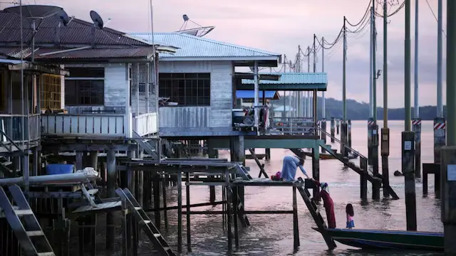 Kampong Ayer, Brunei: Known as Water Village, Kampong Ayer is an ancient settlement along the Brunei River, home to almost 30,000 people who live, work, and learn in houses, schools, and mosques elevated above the water's surface. This town boasts a history of over a thousand years and serves as a vibrant example of water-based urban living in Southeast Asia.