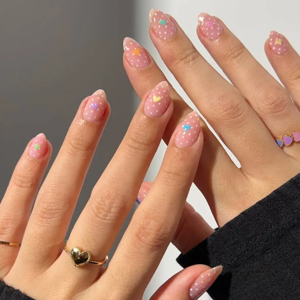 Polka dot decorated nails with tiny hearts