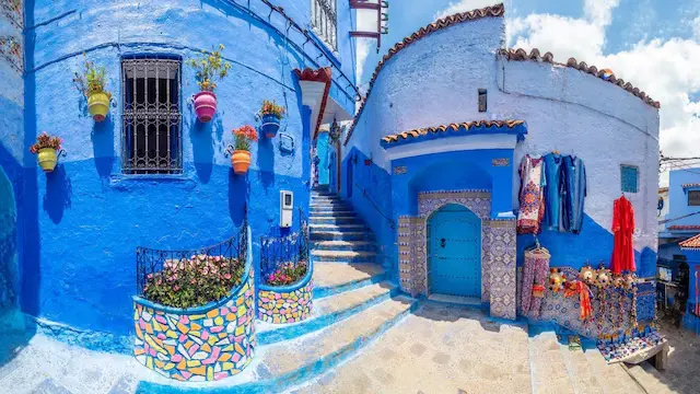 Chefchaouen, Morocco | Nestled in the Rif Mountains, this town is world-famous for its ‘Blue Pearl’ aesthetic, featuring mesmerizing cobalt and azure-painted alleys and stairways, making it unique in every aspect. The walls, steps, and entrances are adorned in various shades ranging from deep blue to sky blue.