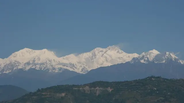 No 7. Kanchenjunga, Sikkim | Mount Kanchenjunga towers over Sikkim, offering some of the most breathtaking views in the Himalayas. Travellers can trek through Yuksom, visit serene monasteries, and enjoy views from Pelling or Singhik. Sacred and majestic, it’s a dream destination for trekkers and spiritual seekers alike.