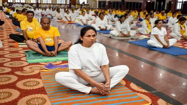 Malasana | Also known as the "garland pose", Malasana is executed by placing the feet wider than hip-width apart and squatting down without curving the spine, with hands folded in 'namaste' position.