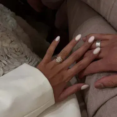 Nails with milky white polish.