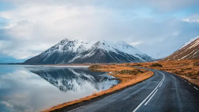 Iceland | Iceland’s winter temperatures are milder than its Arctic neighbours — commonly between 0°C and –10°C near inhabited areas — but its icy landscapes are among the world’s most dramatic. Known as the "land of fire and ice," Iceland blends active volcanoes with glaciers like Vatnajökull, Europe’s largest. From November to March, travellers can explore natural crystal ice caves and soak in geothermal pools such as the famous Blue Lagoon, often under the glow of the northern lights. (Image: Shutterstock)
