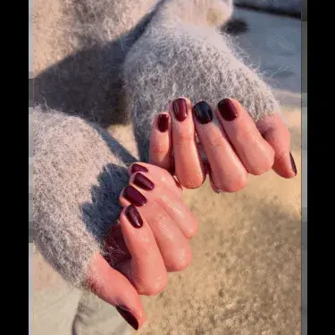 short nails with burgundy polish