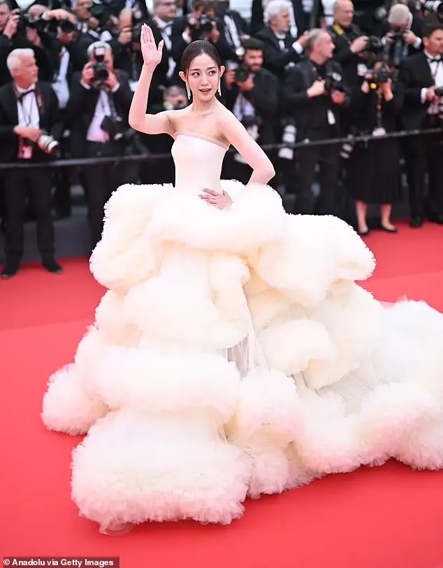 Chinese influencer and actress Wan Qianhui arrived to the event in a dramatic, strapless, white dress containing immense fluffy ruffles